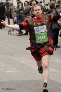 A Roman centurion (or reasonable facsimile) crosses the finish line during the 19th annual Rome marathon on March 17, 2013.